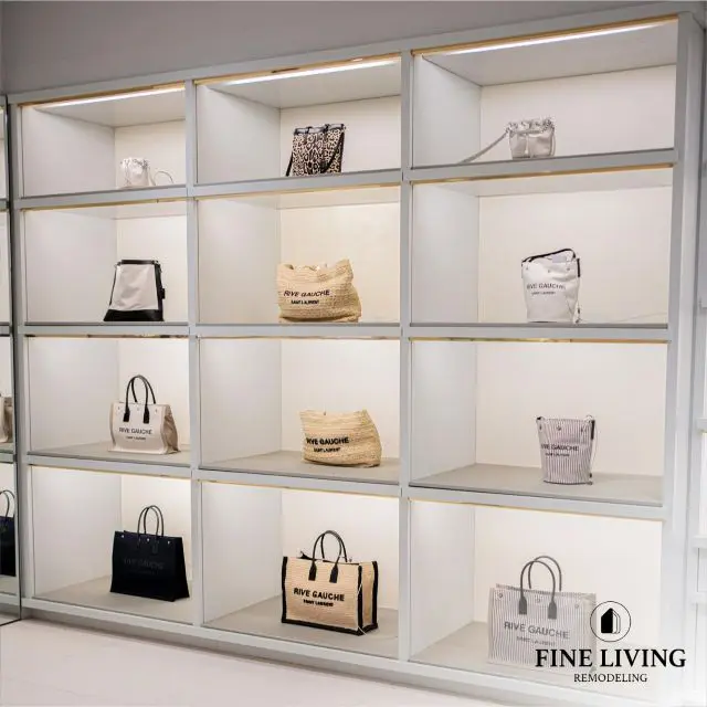 A display case with many different bags of purses.